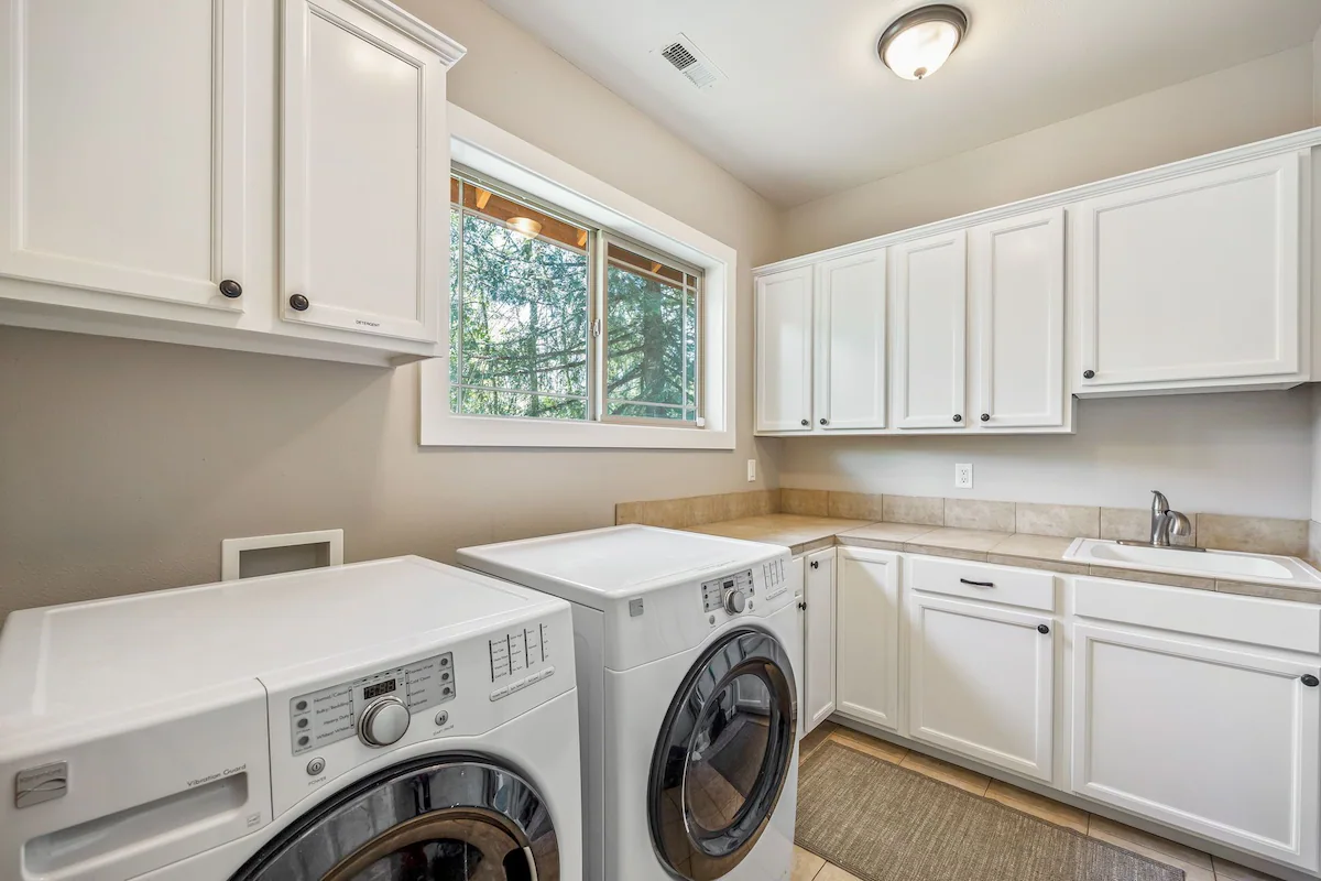 laundry room is stocked with detergent and supplies